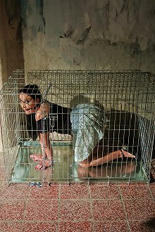 Slave gets caged by her master